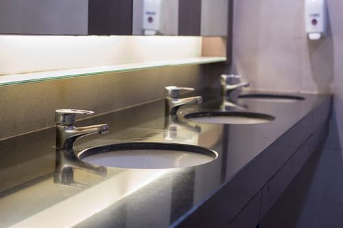 Image is of a commercial bathroom concept of Boca Raton commercial plumbing